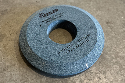 A high performance profile grinding wheel from Weiler Abrasives, showing the high porosity of the wheel. These high performance wheels offer better form holding and longer wheel life.